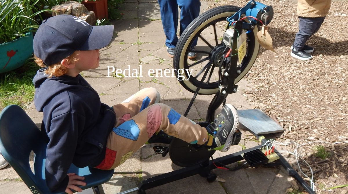 an image of a child generating power on a bicycle